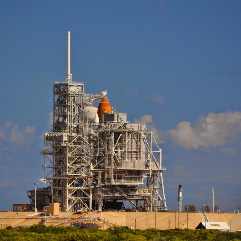 After a postponed launch, Discovery is "safed" and protected by the Rotating Service Structure. About half-way up the launch tower, see the 7 emergency egress baskets.